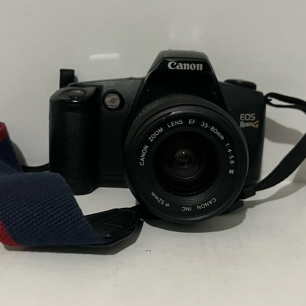 Canon EOS Rebel Camera with Black and Red Strap